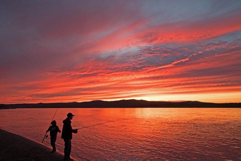 A Father & Son Doing Some Late Night Fishing In Alaska Under The Midnight Sun…That Is Setting